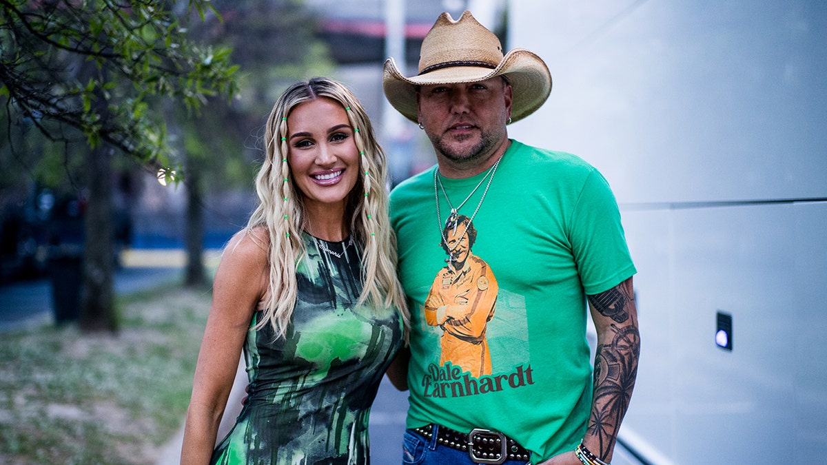 Brittany Aldean with Jason Aldean in a cowboy hat