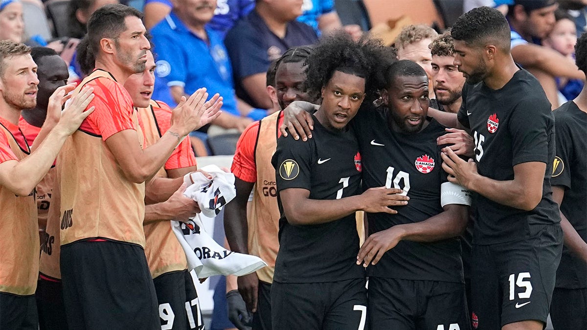 Jayden Nelson celebrates with Junior Hoilett