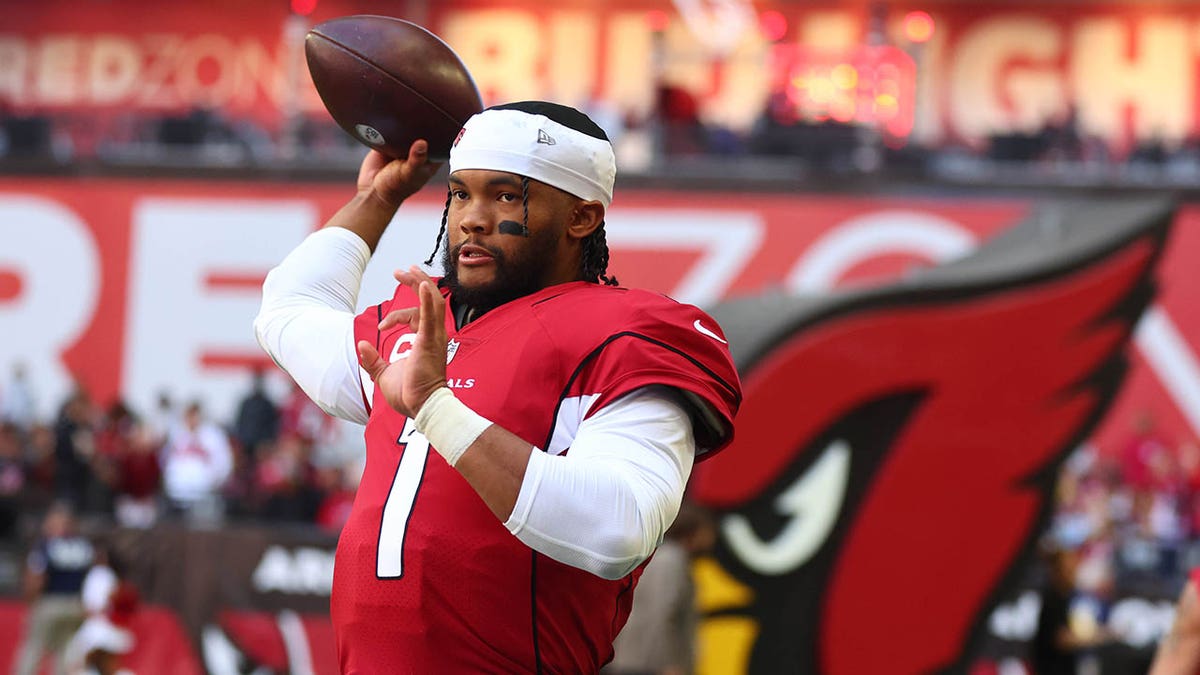 Quarterback Kyler Murray warms up