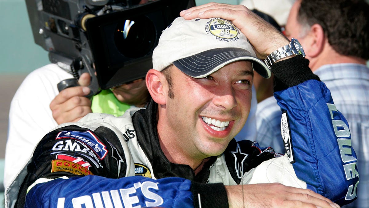 Chad Knaus grins