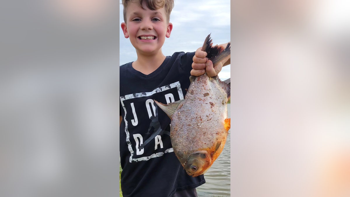 Charlie holding the Pacu fish