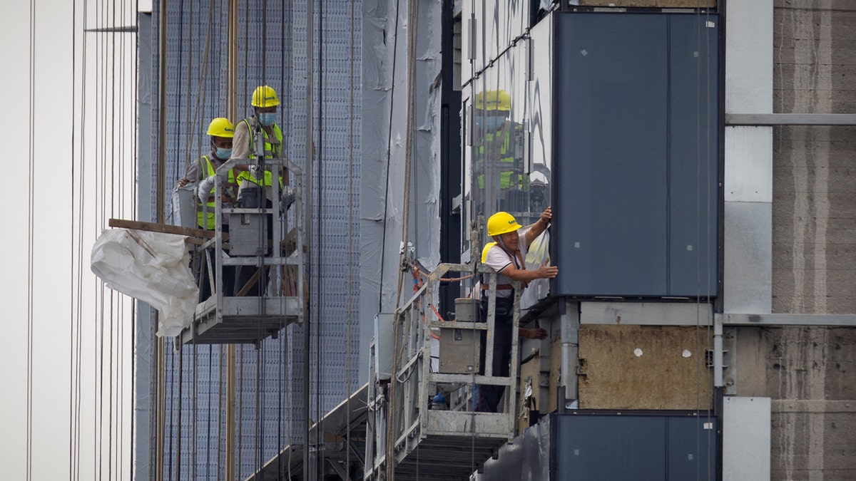 Men working on apartment building