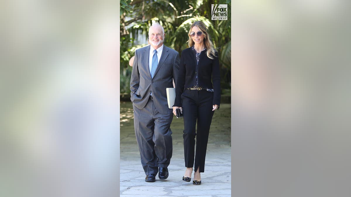 Christine Baumgartner walks in the courtyard of the court with her lawyer