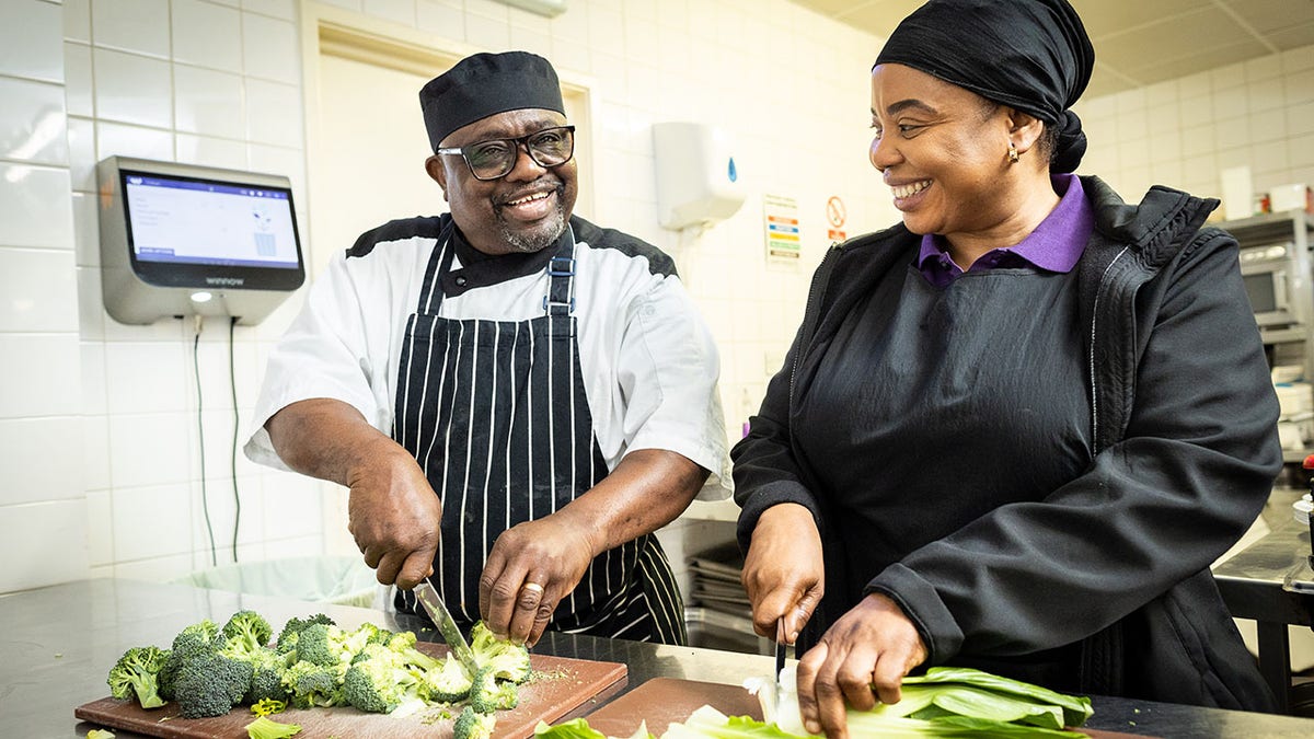 two chefs chopping veggies