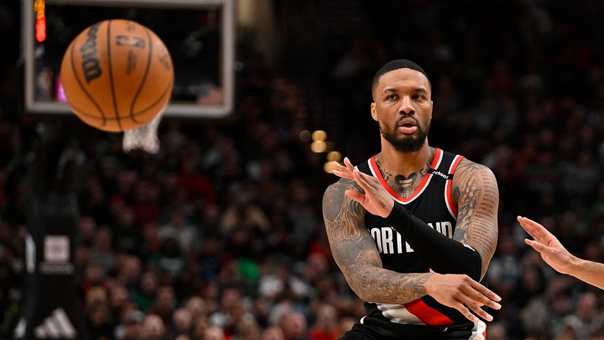 Damian Lillard passes the ball