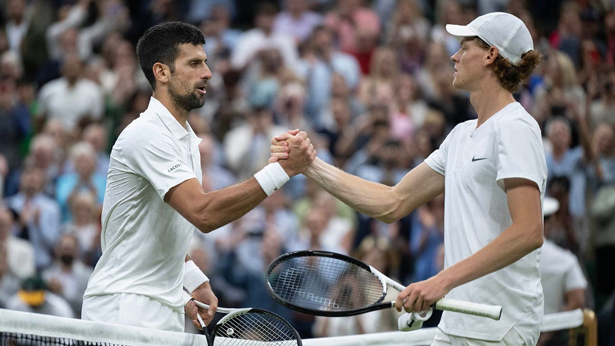 Novak Djokovic shakes hands with Jannik Sinner