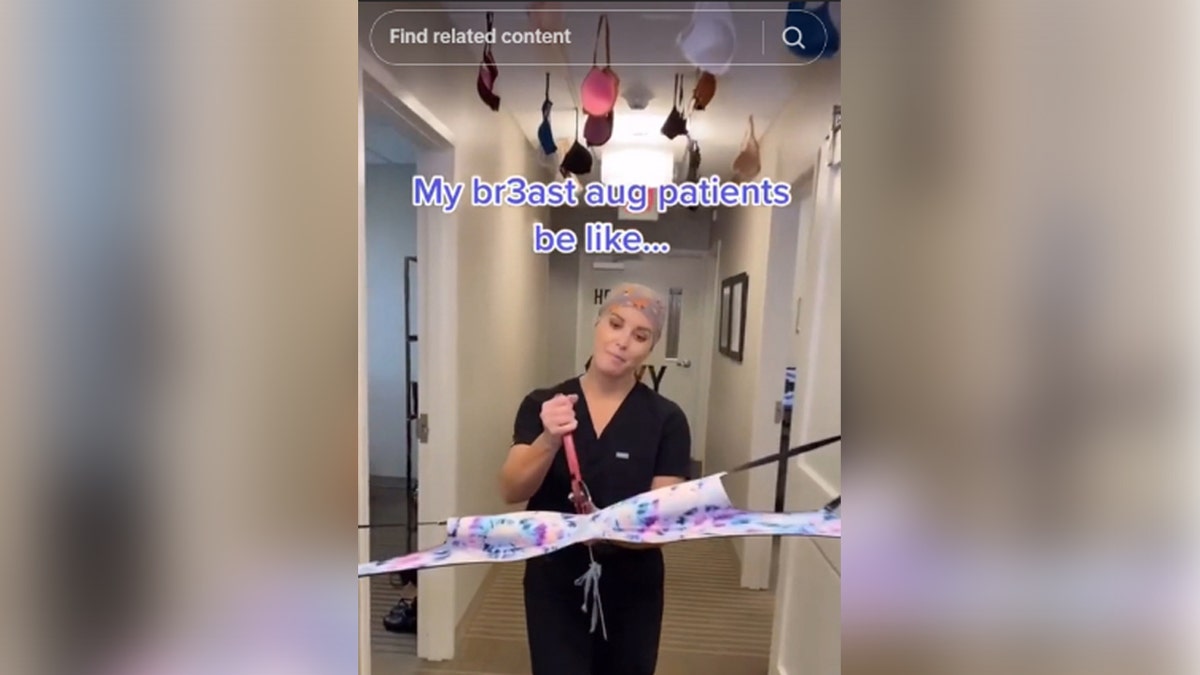 TikTok famous Plastic Surgeon Dr. Roxy cutting a bra with giant scissors and bras hanging from ceiling