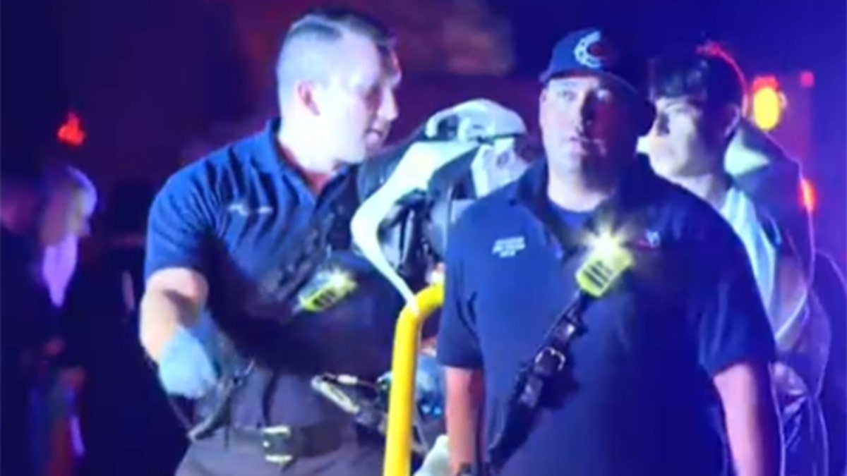 EMT taking person on a stretcher from El Paso, Texas house party shooting