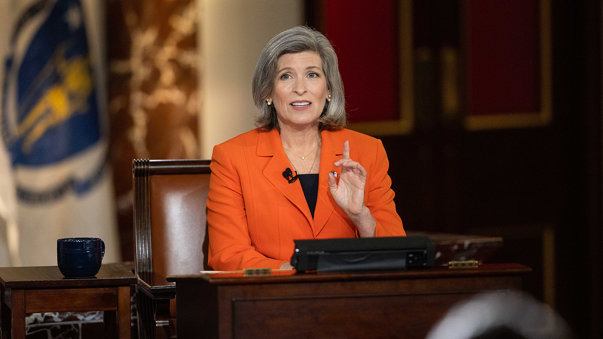 Joni Ernst, Iowa Republican, in orange coat