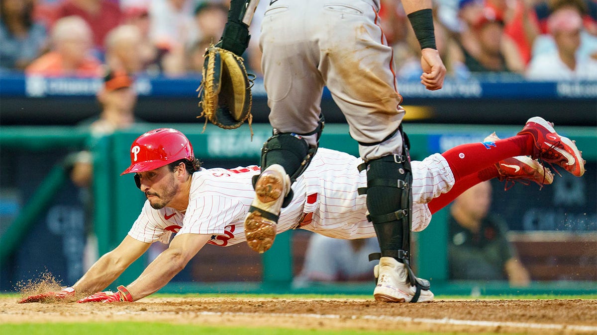 Garrett Stubbs dives into home