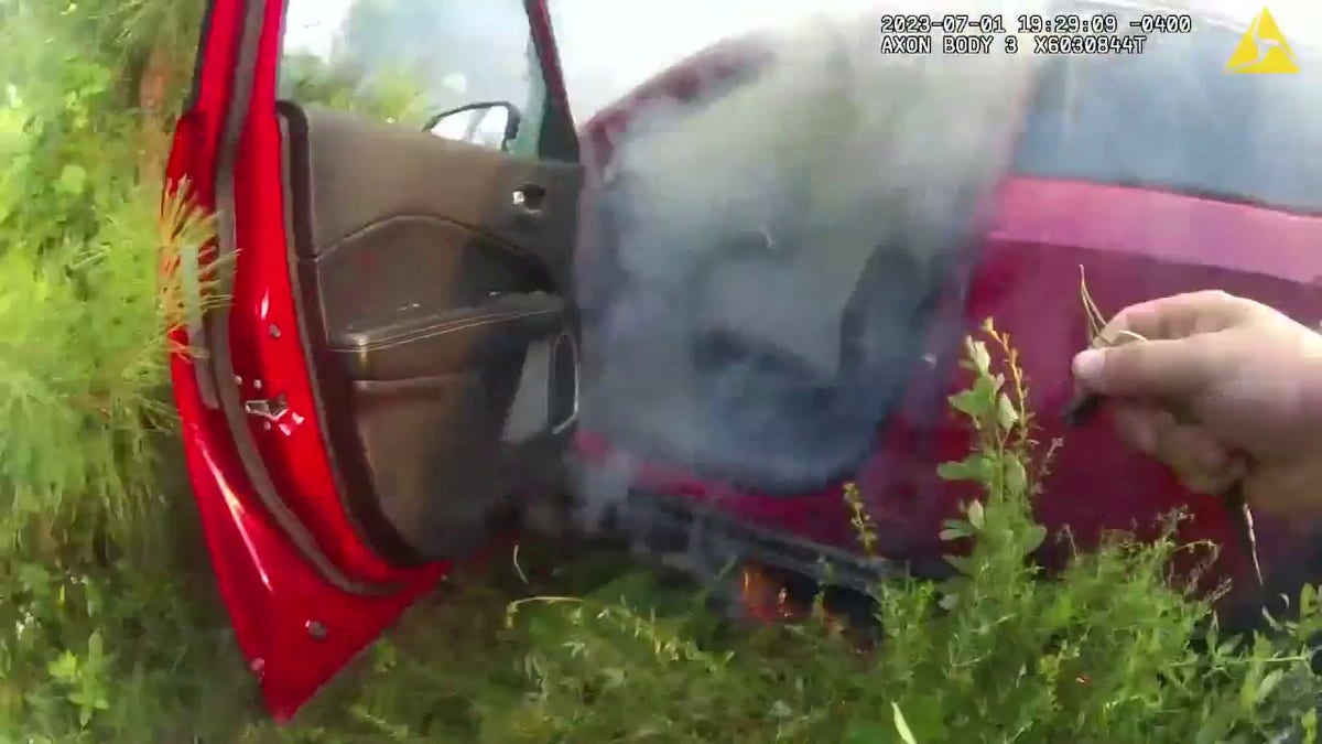 Smoke filling a red car