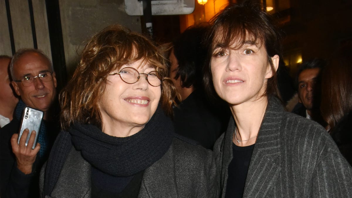 Jane Birkin smiles with her daughter Charlotte Gainsbourg in Paris