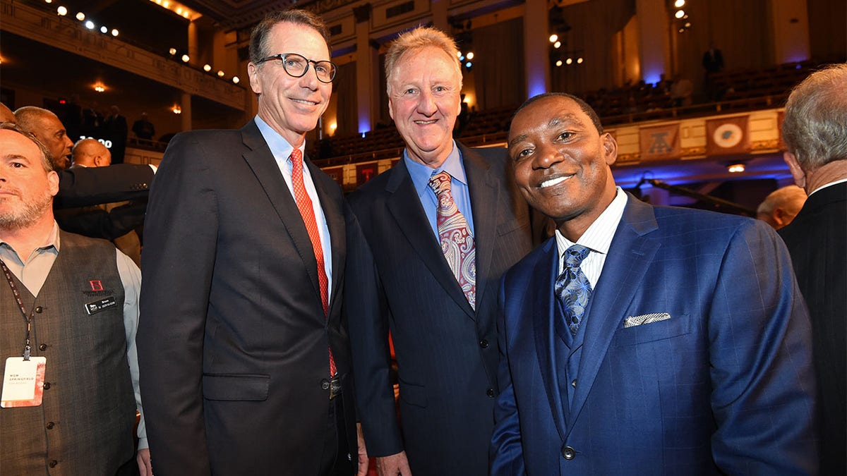 Kiki Vandeweghe, Larry Bird, and Isiah Thomas pose for a photo