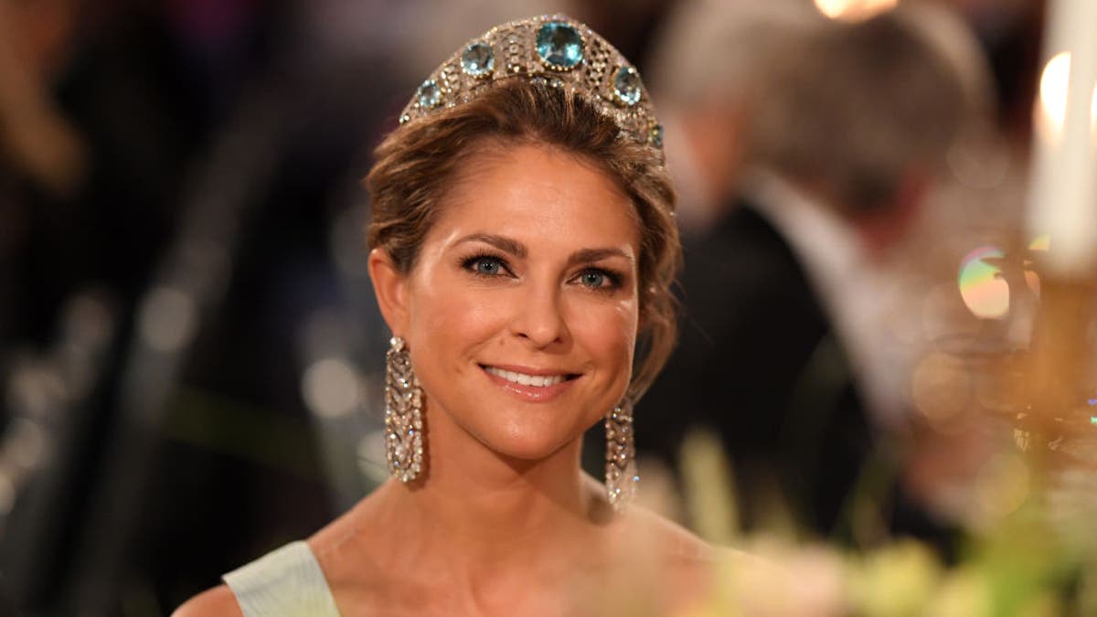 princess madeleine of sweden smiling and wearing crown