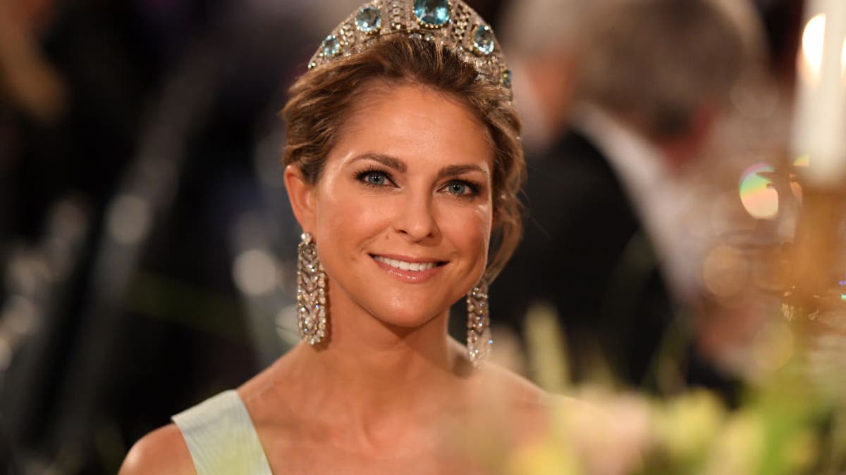 princess madeleine of sweden smiling and wearing crown