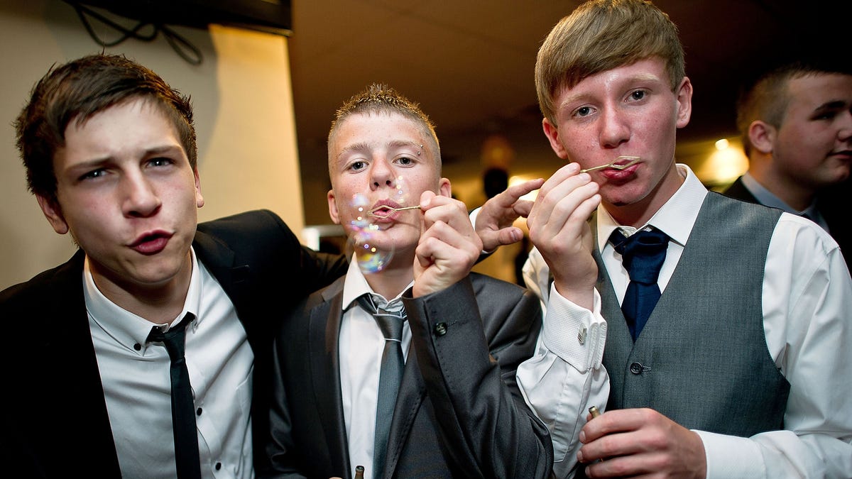 Teenagers blow bubbles during the school prom on July 1, 2011 in Newcastle, United Kingdom.