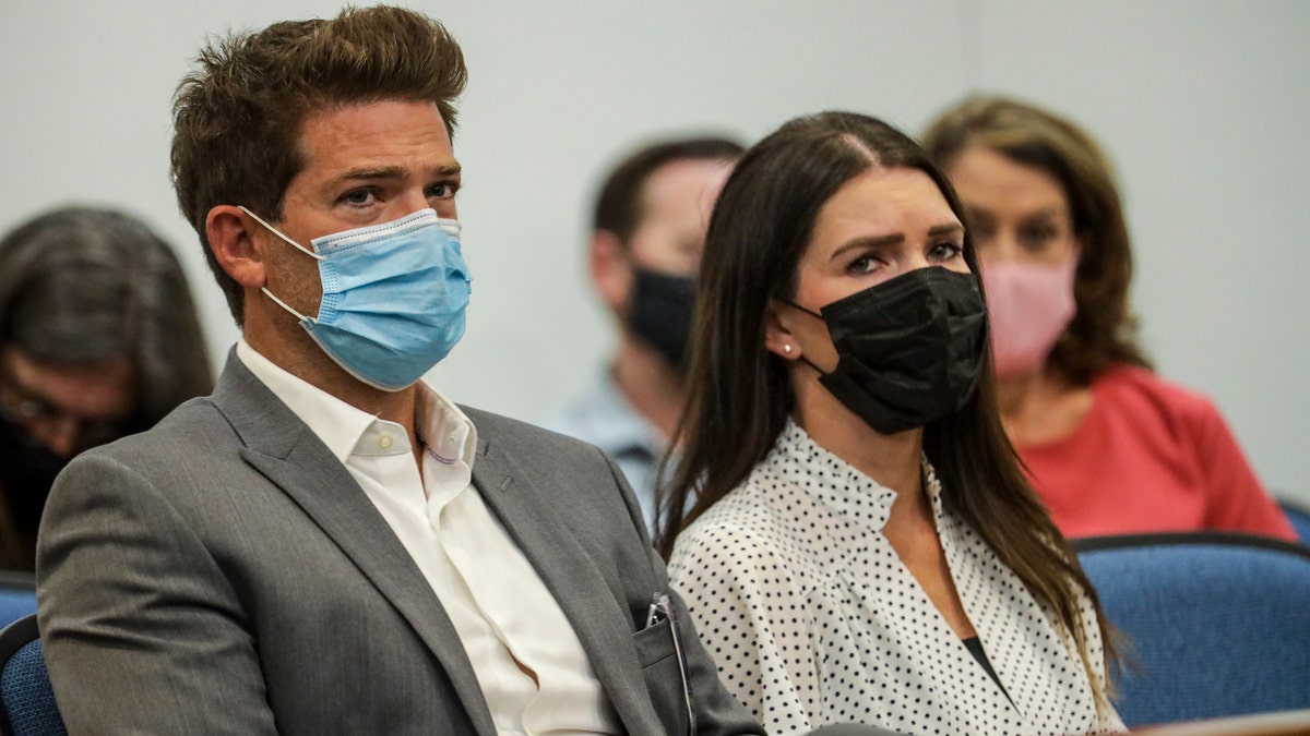 Dr. Grant Robichaux and Cerissa Riley wear face masks in court
