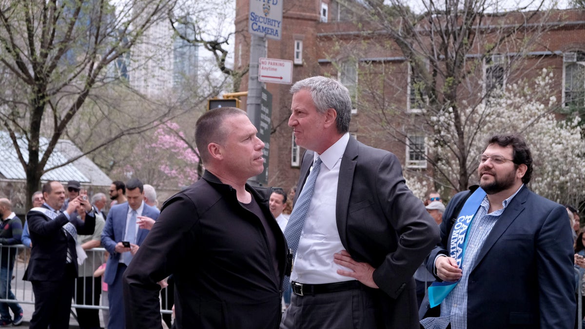 De Blasio talks outside with head of security Howard Redmond