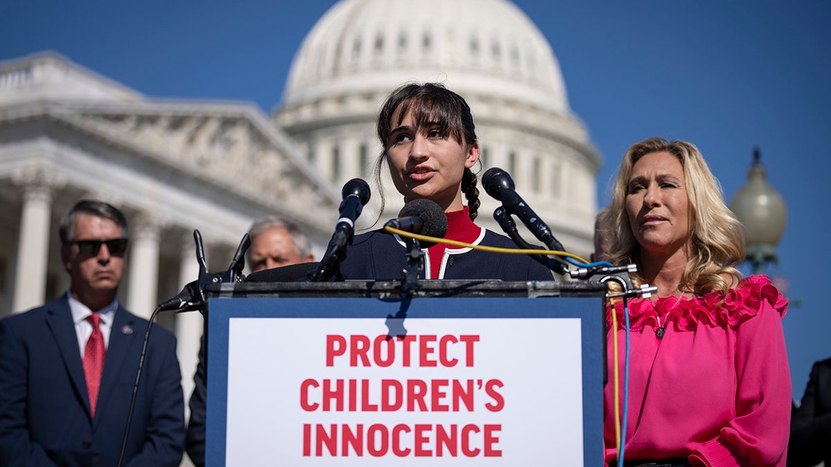 Chloe Cole stands before the Capitol building