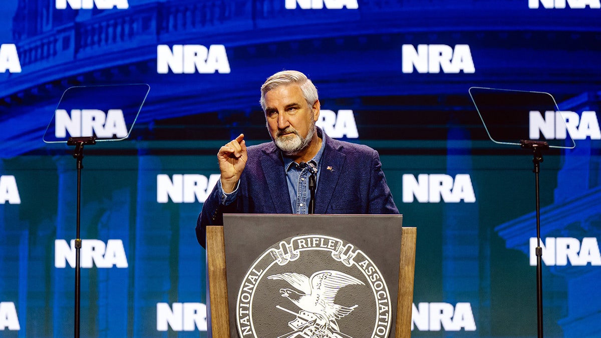 Eric Holcomb on NRA stage
