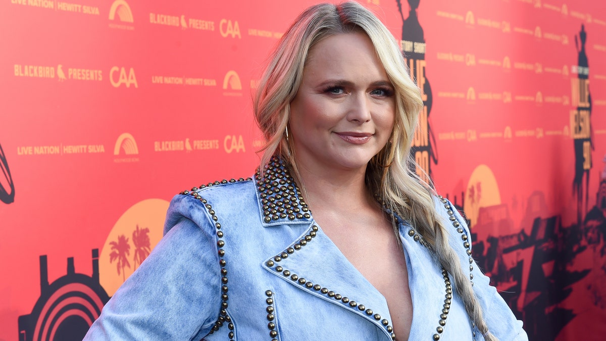 Miranda Lambert in a jean jacket with a braid at an event for Willie Nelson