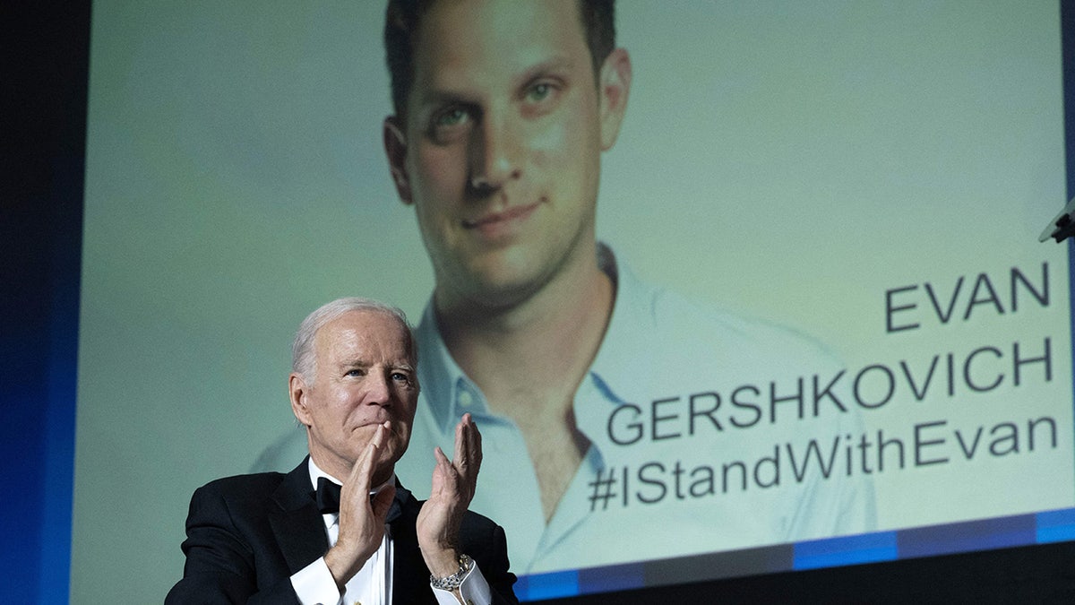 Photo of Evan Gershkovich on billboard behind President Biden