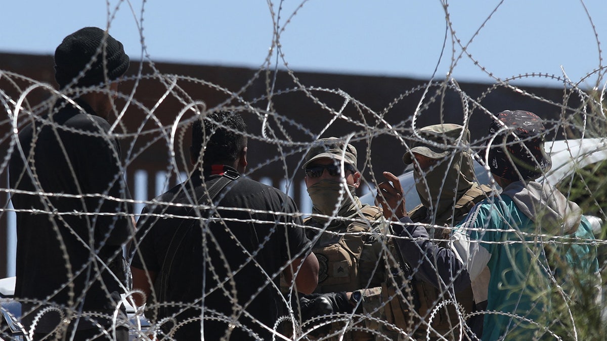 Border Patrol confronts migrant at US-Mexico border