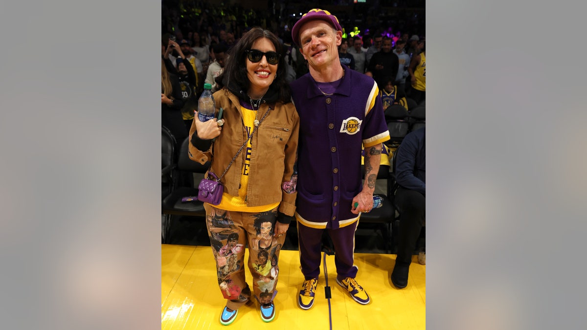 Flea with wife Melody Ehsani at a Lakers Game