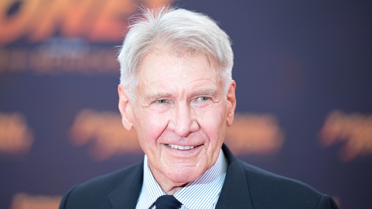 Harrison Ford smiles on the red carpet for "Indiana Jones"