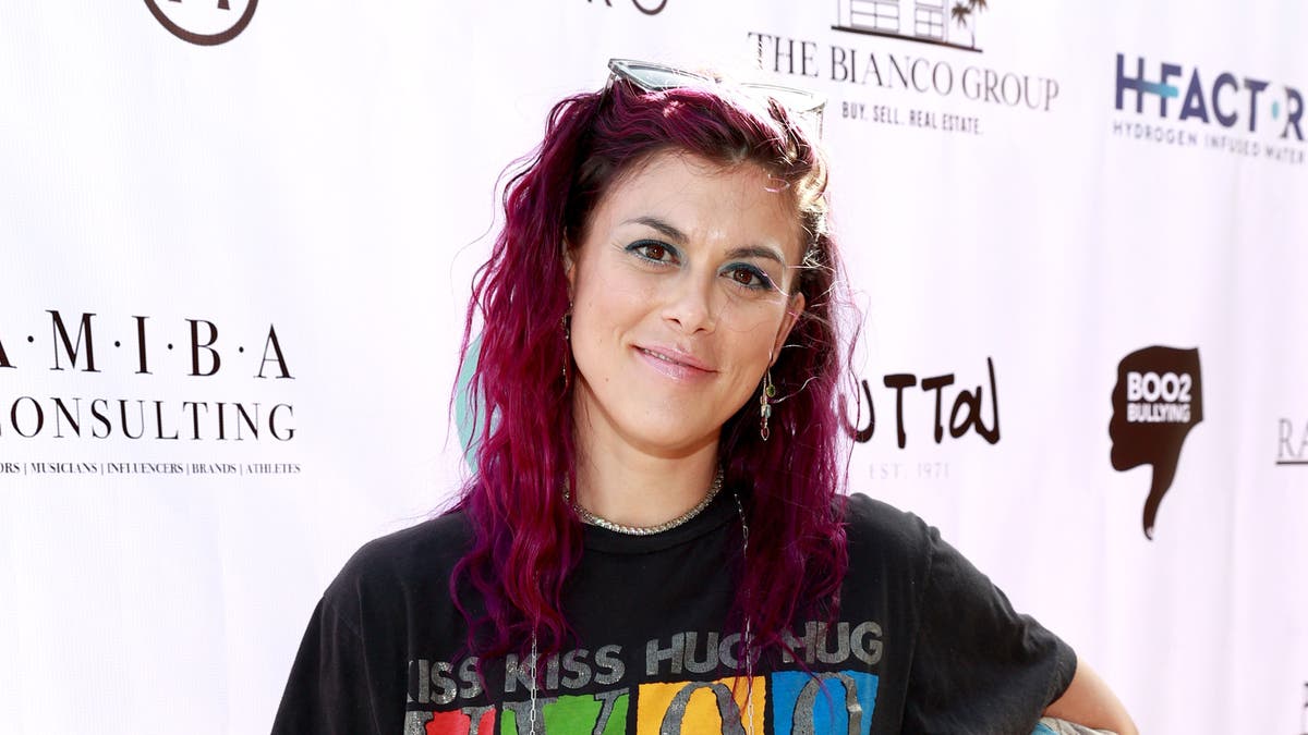 Lindsey Shaw with bright pink hair
