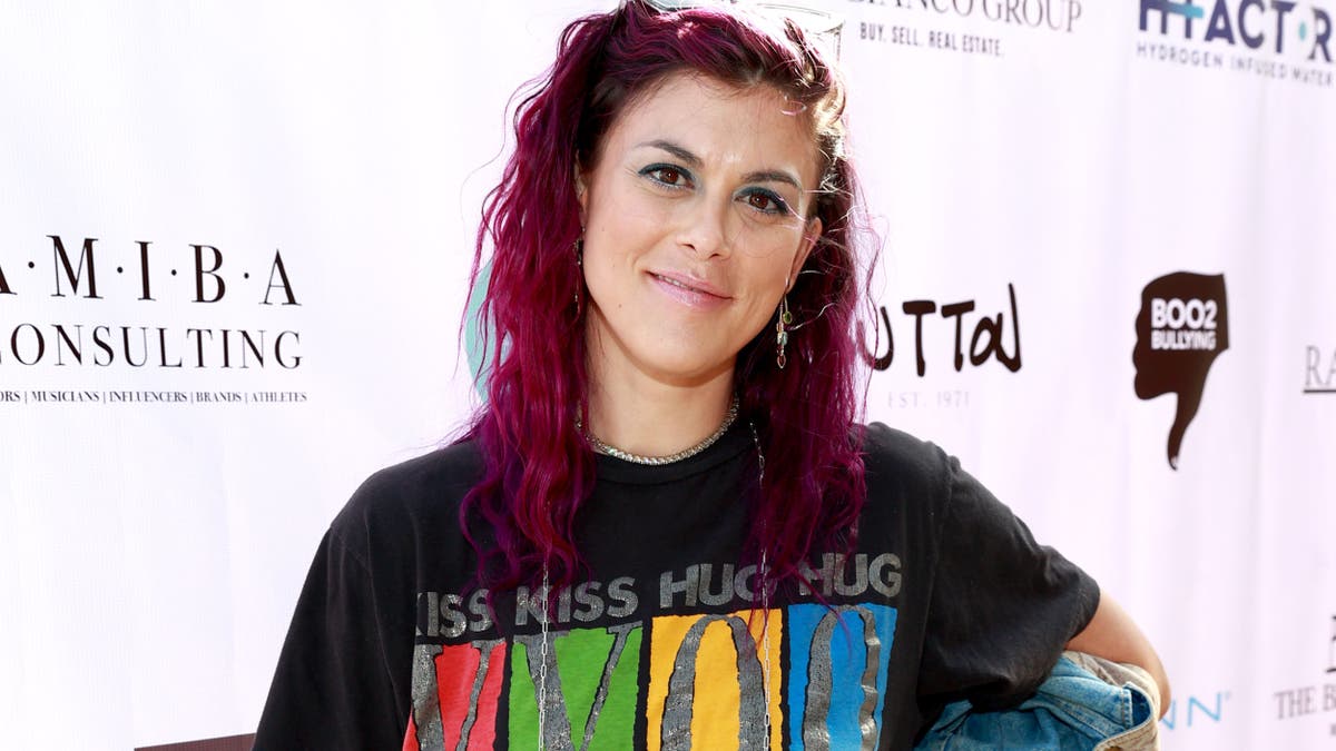 Lindsey Shaw with bright pink hair