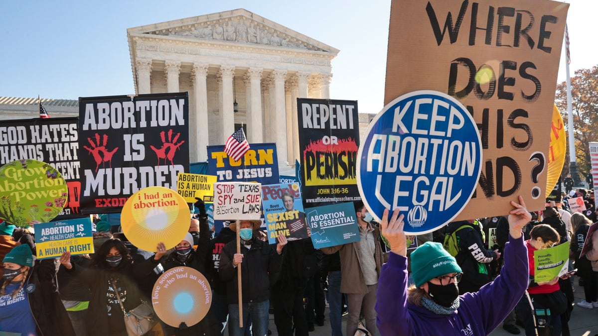 Demonstrators gather in front of the U.S. Supreme Court as the justices hear arguments in Dobbs v. Jackson Women's Health, a case about a Mississippi law that bans most abortions after 15 weeks, on December 1, 2021 in Washington, D.C.