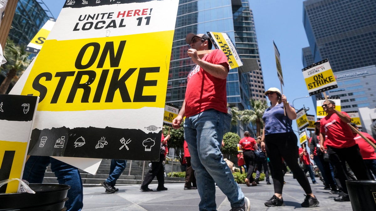 Striking hotel workers walk the picket line outside the Intercontinental Hotel in Los Angeles, California, on July 2, 2023.