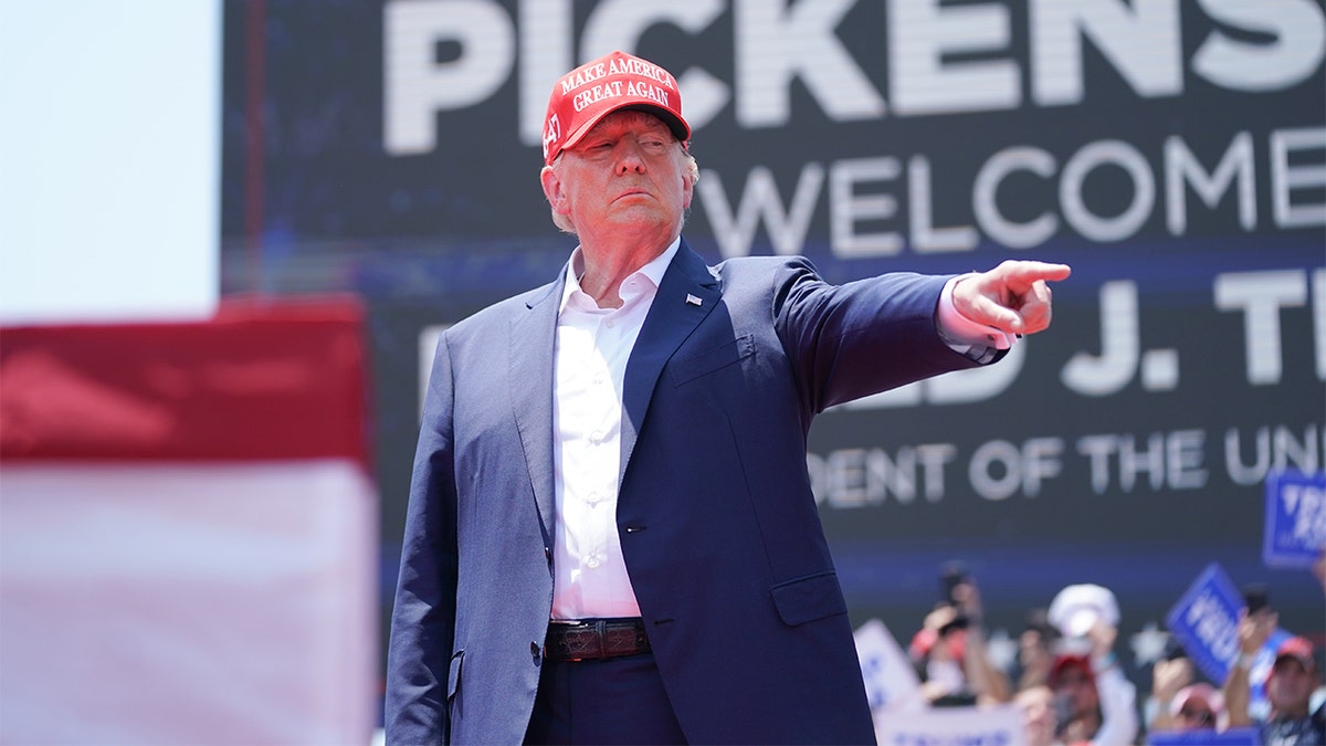 Former President Donald Trump pointing at a rally