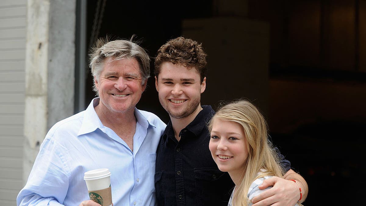 Treat Williams smiling with son and daughter