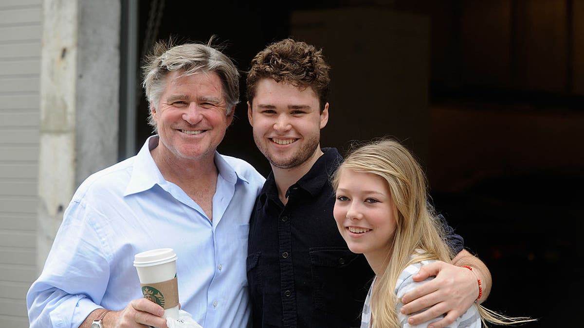 Treat Williams smiling with son and daughter