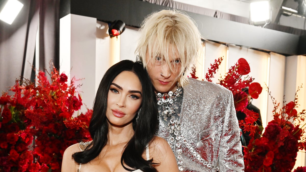 Megan Fox and Machine Gun Kelly, in silver and white outfits