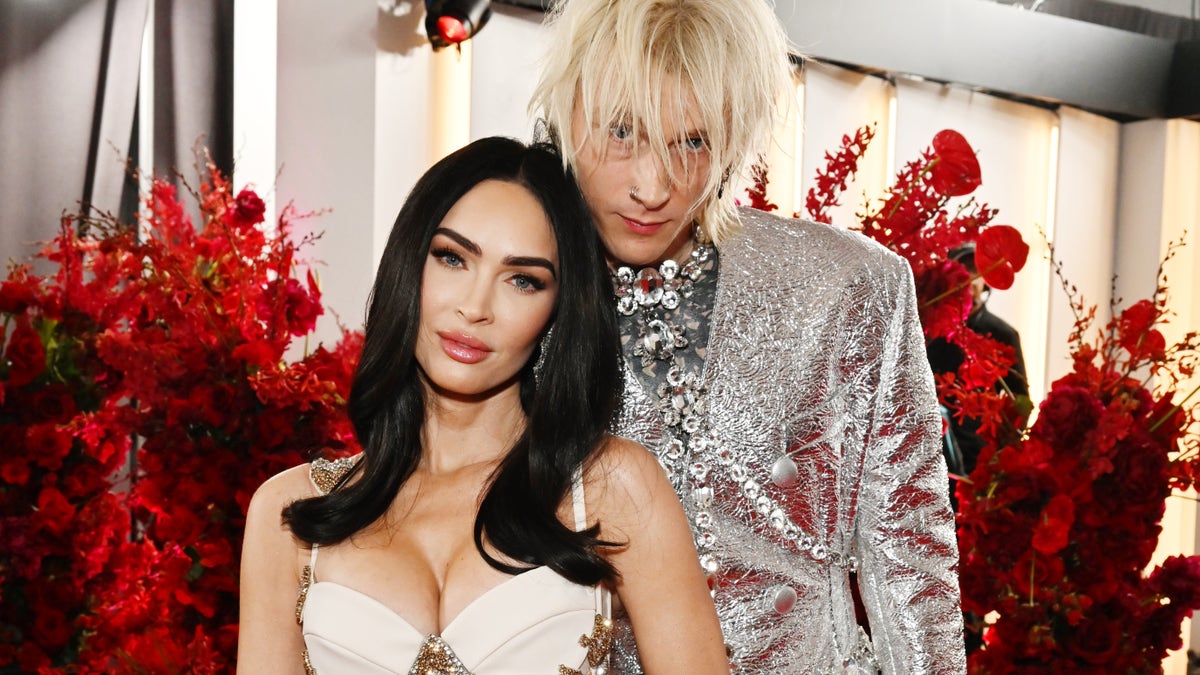 Megan Fox and Machine Gun Kelly, in silver and white outfits