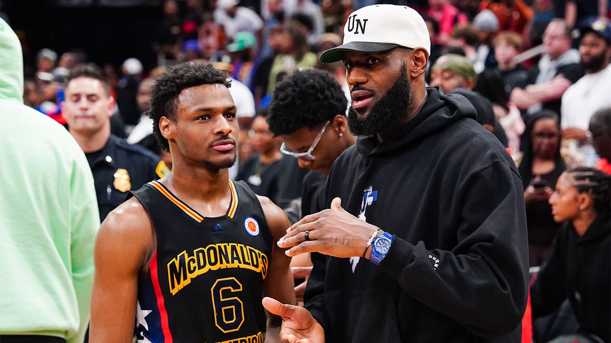 Bronny James talks with his dad, LeBron James