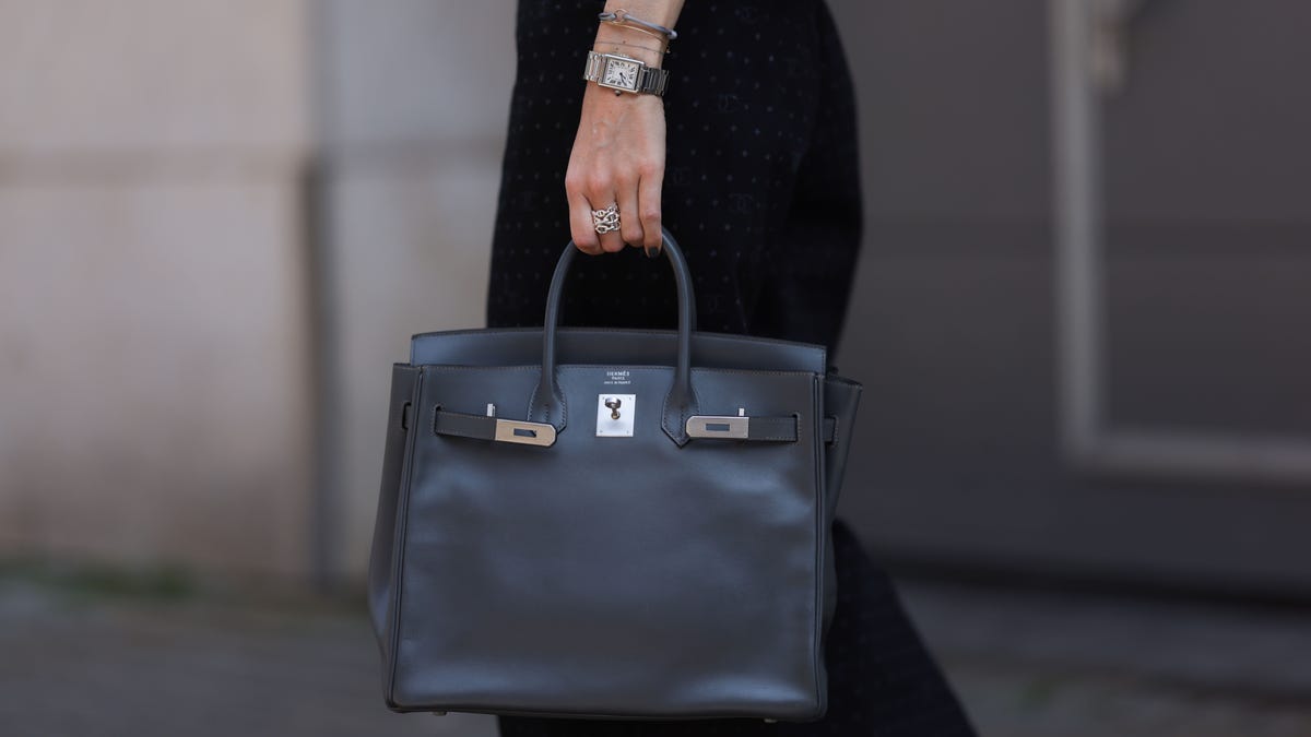 Black Birkin bag held by a woman in Germany
