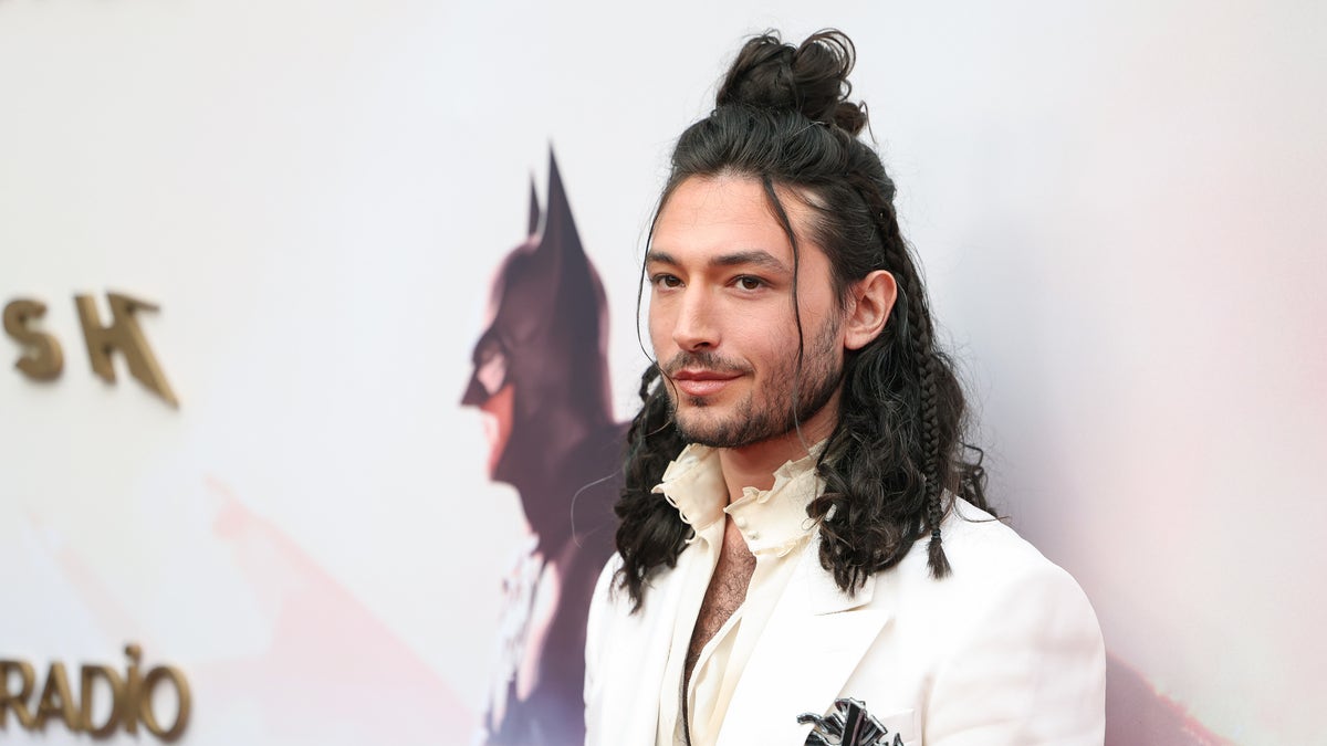 Ezra Miller in white jacket at "The Flash" premiere