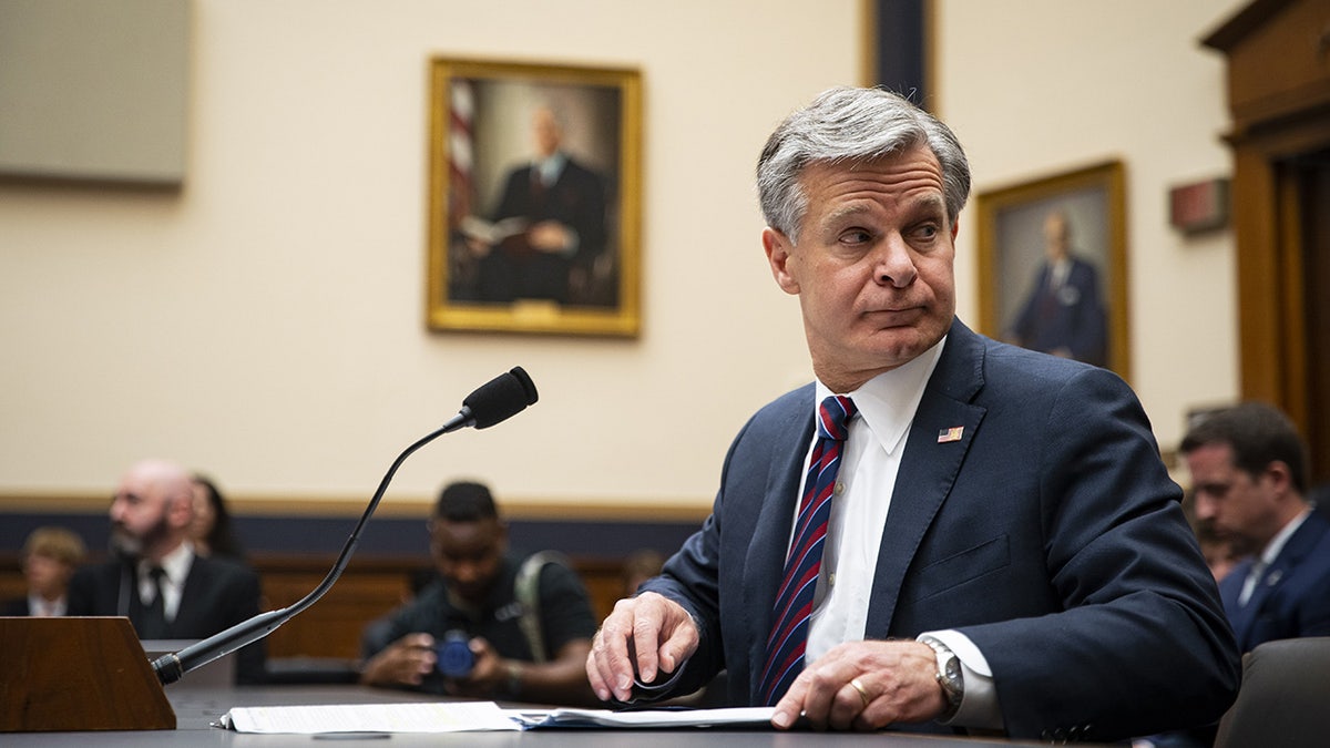 Chris Wray prepares to be questioned by the House Judiciary Committee