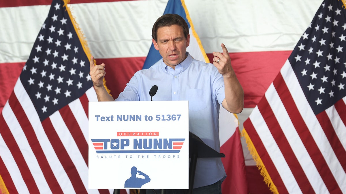 DeSantis at the podium during Iowa campaign stop