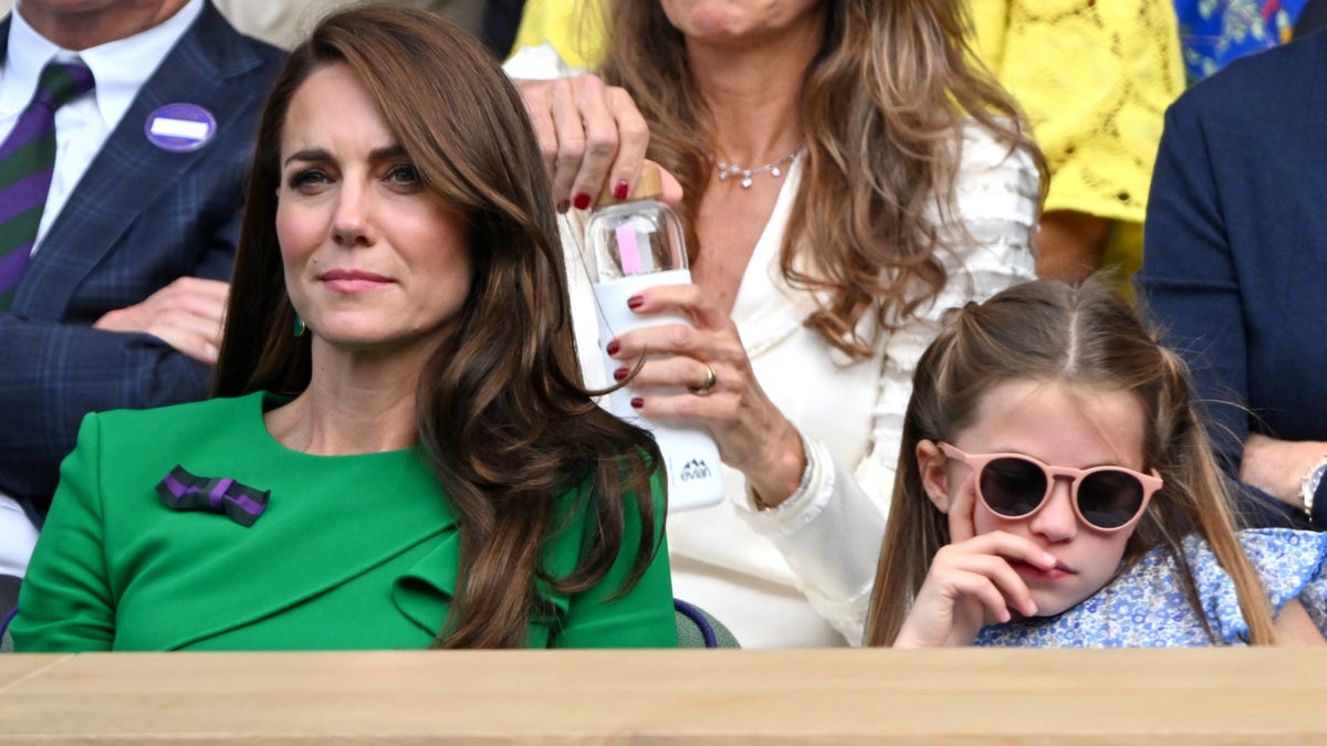 Kate Middleton and Princess Charlotte watch Wimbledon in the stands.