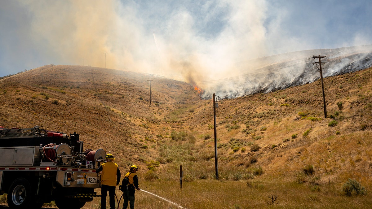 Firefighters prepare to fight a fire