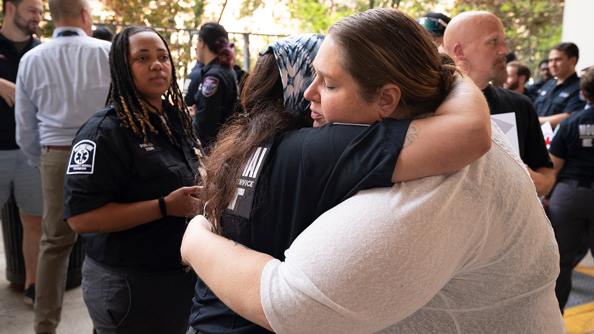Mom embraces daughter