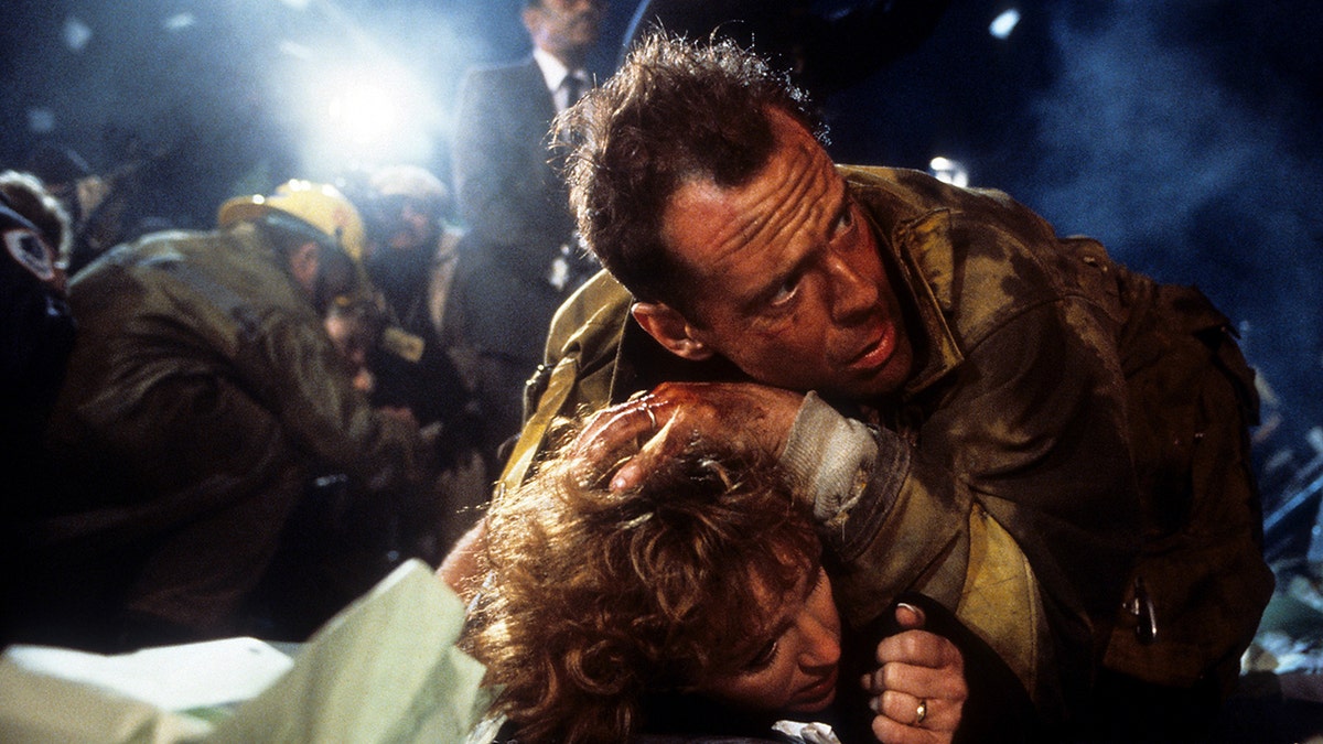 A scene from Die Hard with Bonnie Bedelia and Bruce Willis