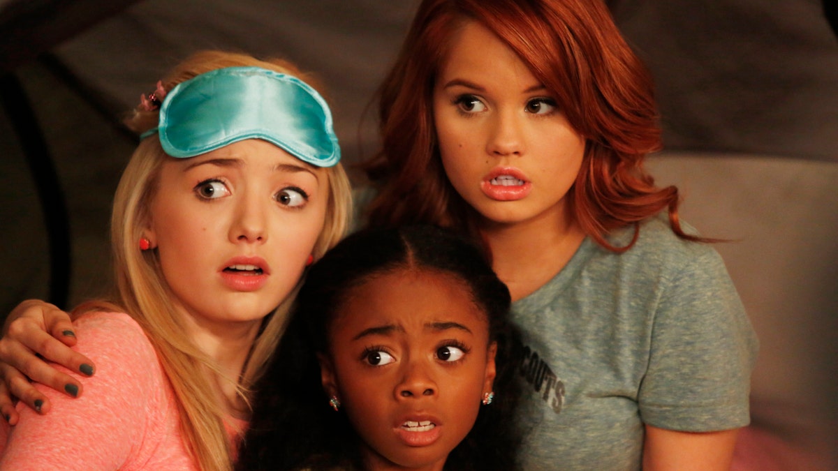 Skai Jackson as Zuri, Peyton List as Emma and Debby Ryan as Jessie on the show "Jessie" looking scared