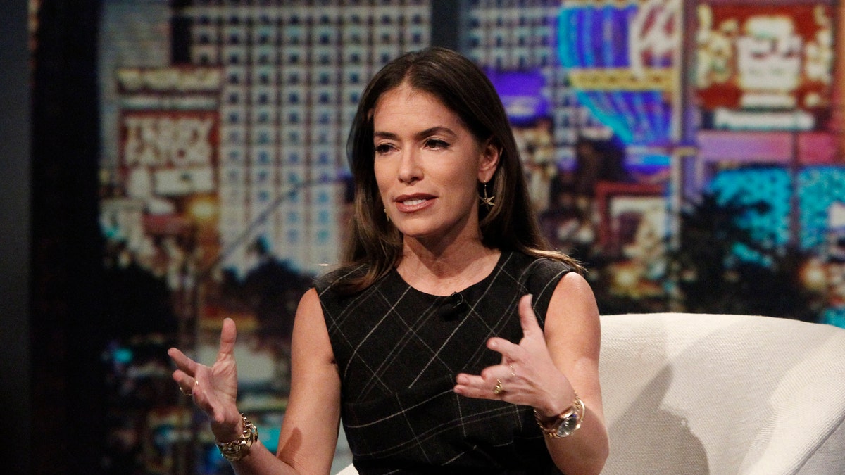 Laura Wasser sitting in a chair and talking with her hands