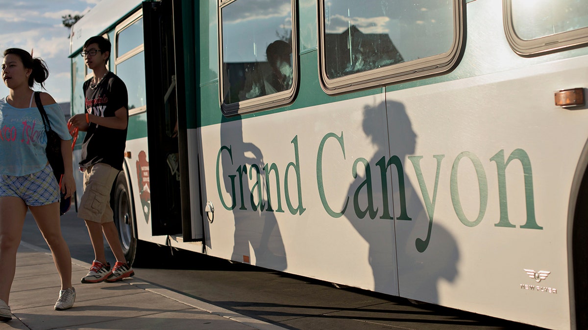 Guests exit a shuttle bus at Grand Canyon 